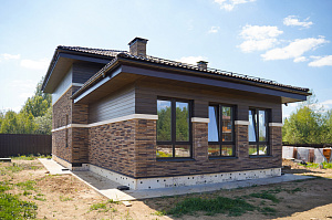 Отделка фасада термолиственницей с защитным покрытием WoodSol-455 в КП Дмитровец 7